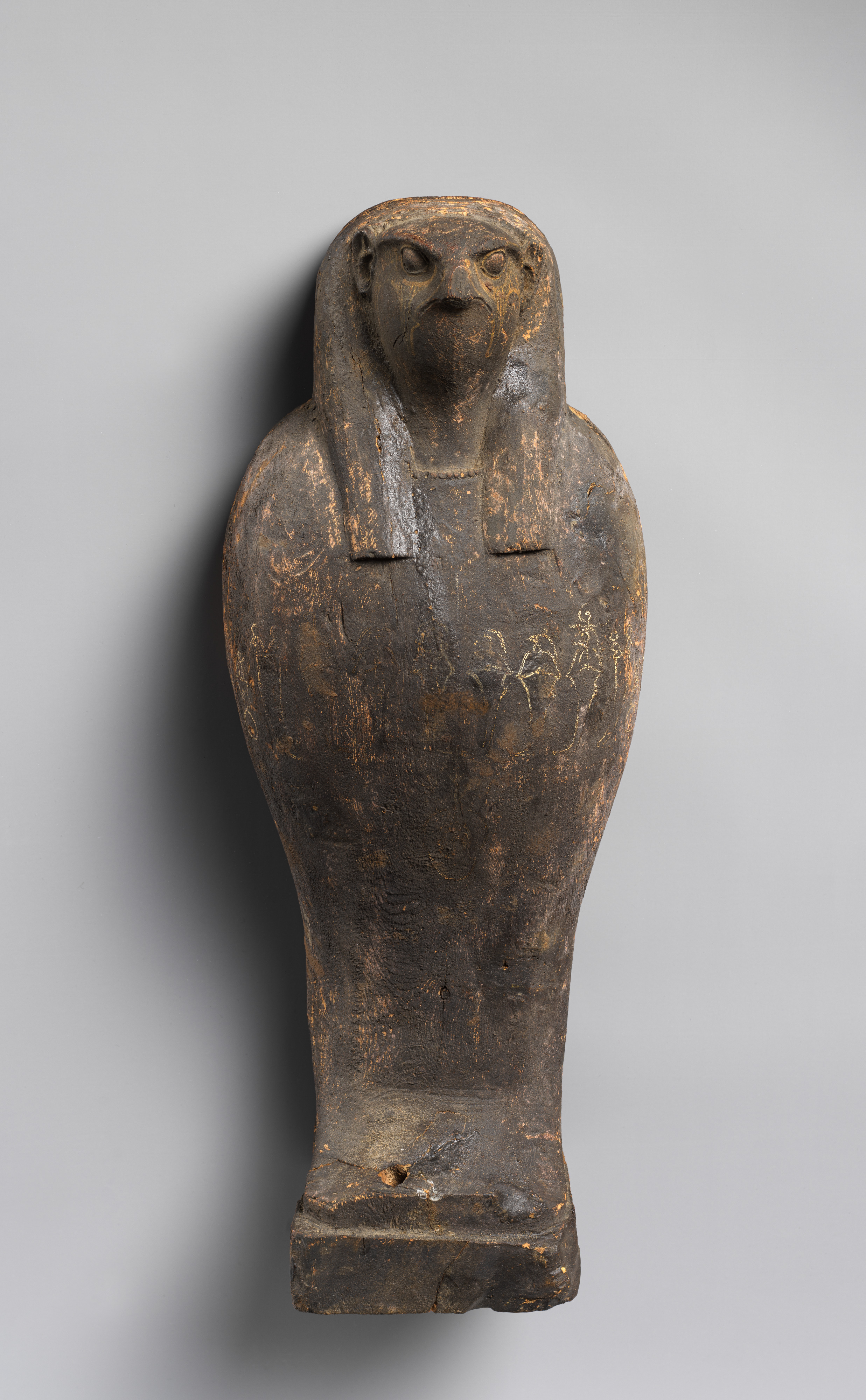 The closed falcon-headed coffin belonging to an Osiris grain-mummy ensemble.